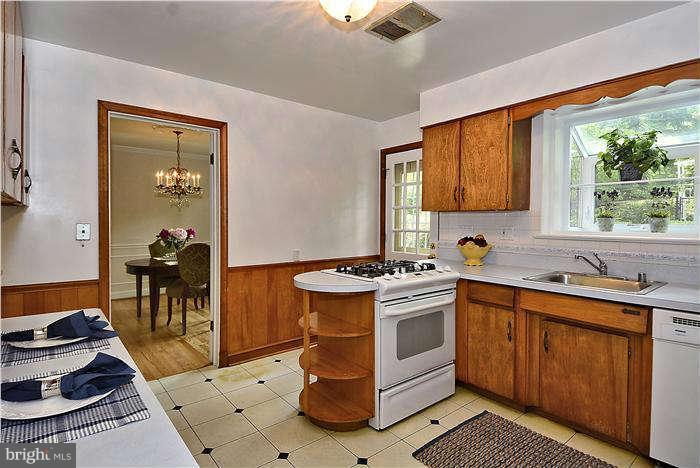 3216 Park View Road Chevy Chase, MD 20815 - Photo 10 of 29 a kitchen with a stove and a sink