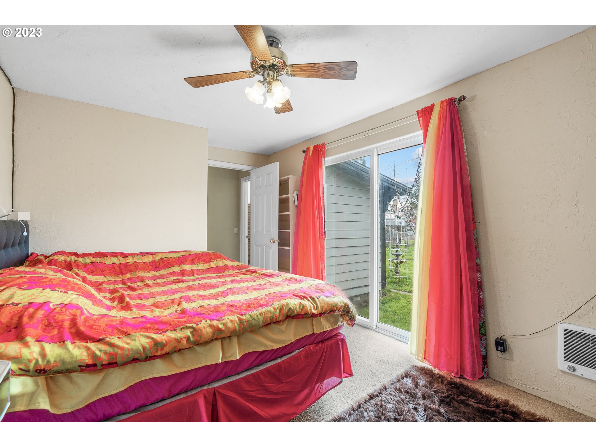 471 West M Street Springfield, OR 97477 - Photo 15 of 37 a bedroom with a bed and a chandelier
