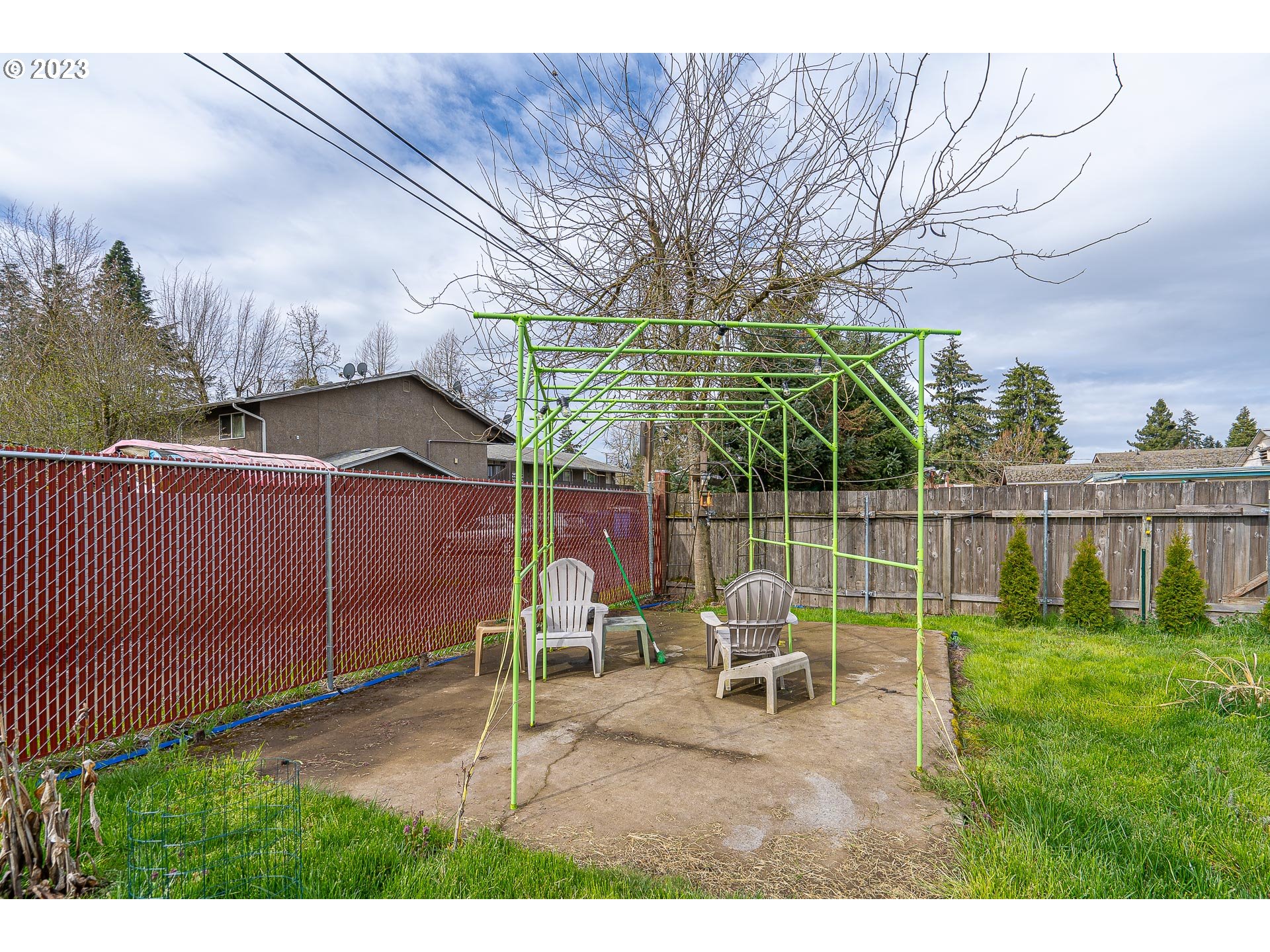 471 West M Street Springfield, OR 97477 - Photo 26 of 37 a view of a backyard with sitting area and slide