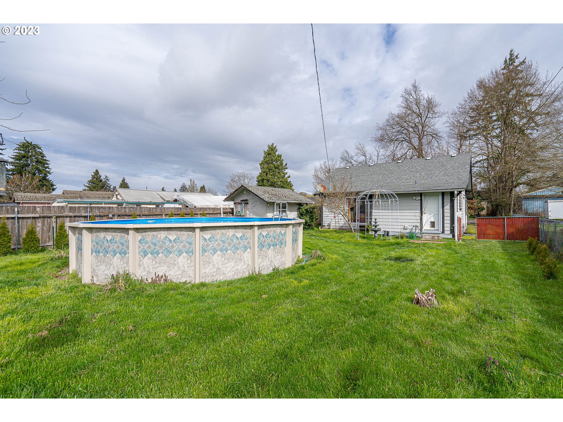 471 West M Street Springfield, OR 97477 - Photo 27 of 37 a view of a house with a yard and sitting area