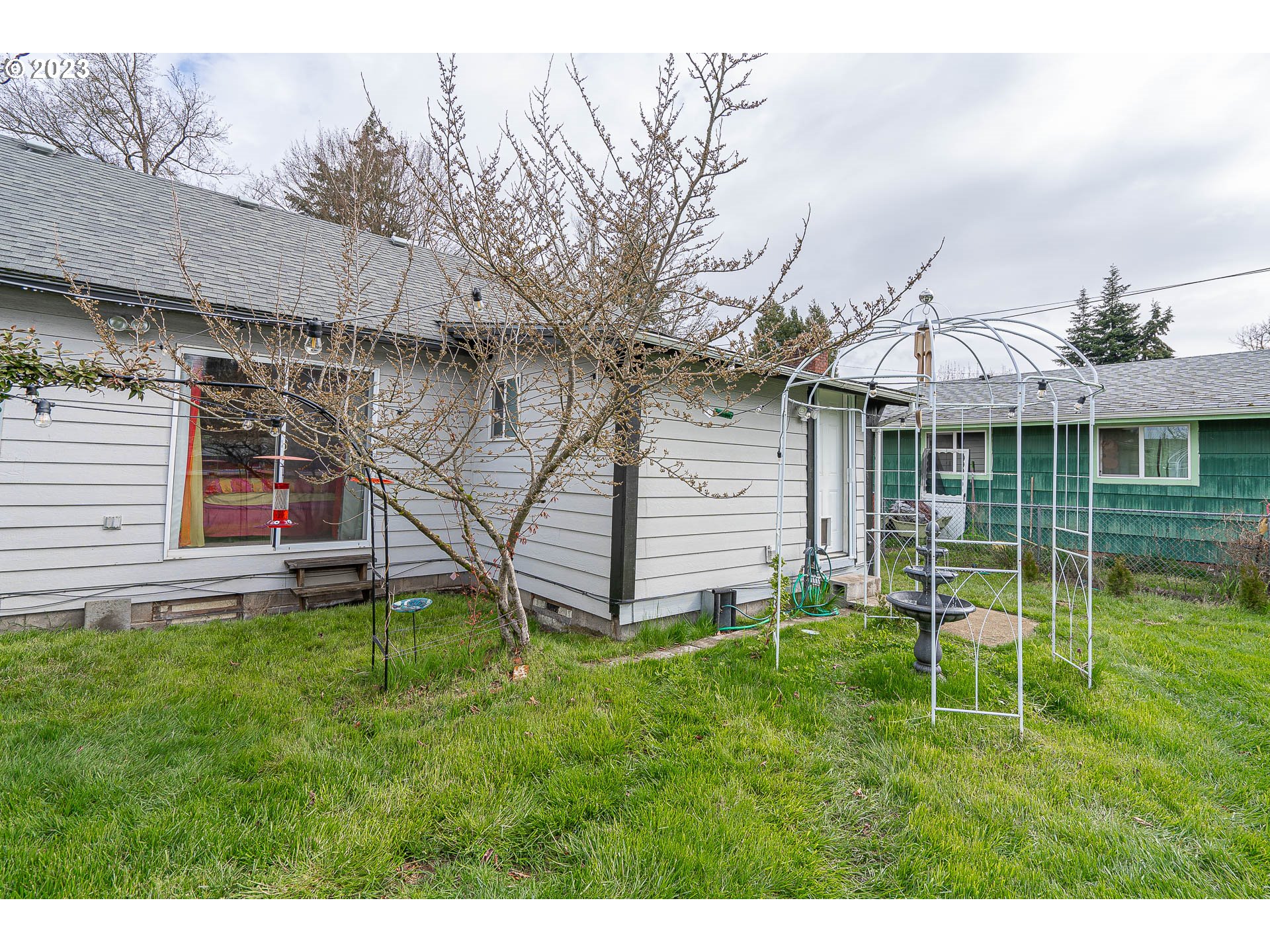 471 West M Street Springfield, OR 97477 - Photo 29 of 37 a view of a house with a yard and sitting area