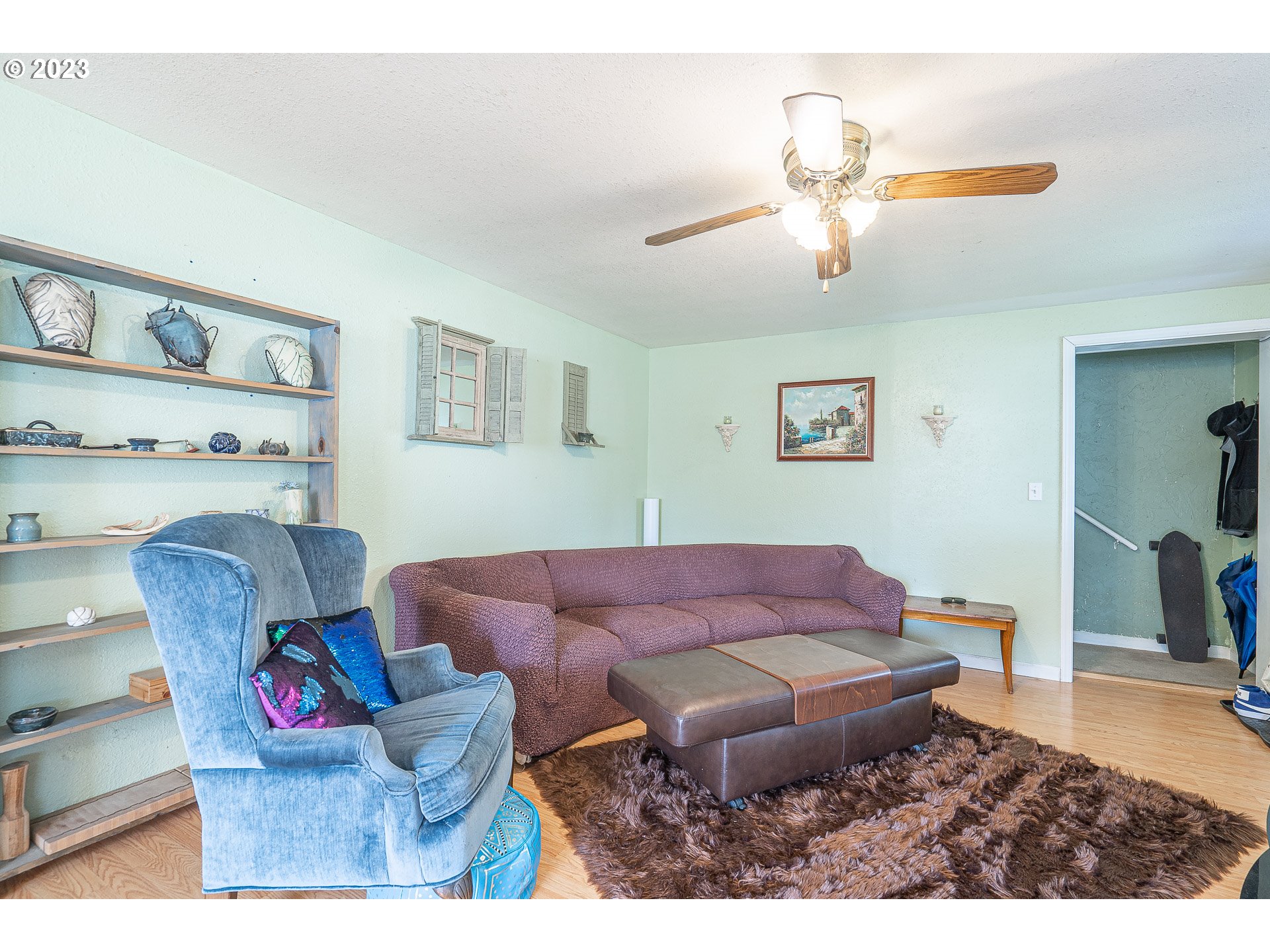 471 West M Street Springfield, OR 97477 - Photo 5 of 37 a living room with furniture and a chandelier