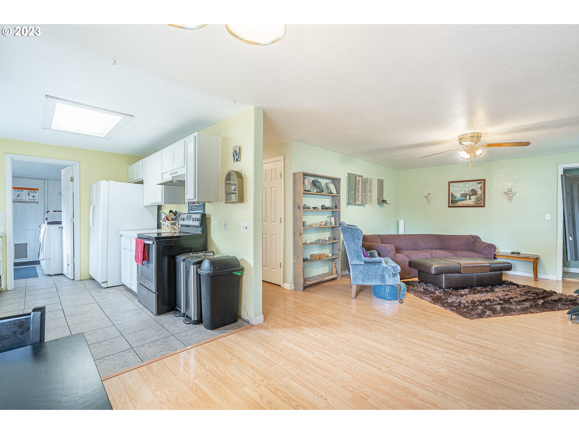 471 West M Street Springfield, OR 97477 - Photo 7 of 37 a living room with furniture and a wooden floor