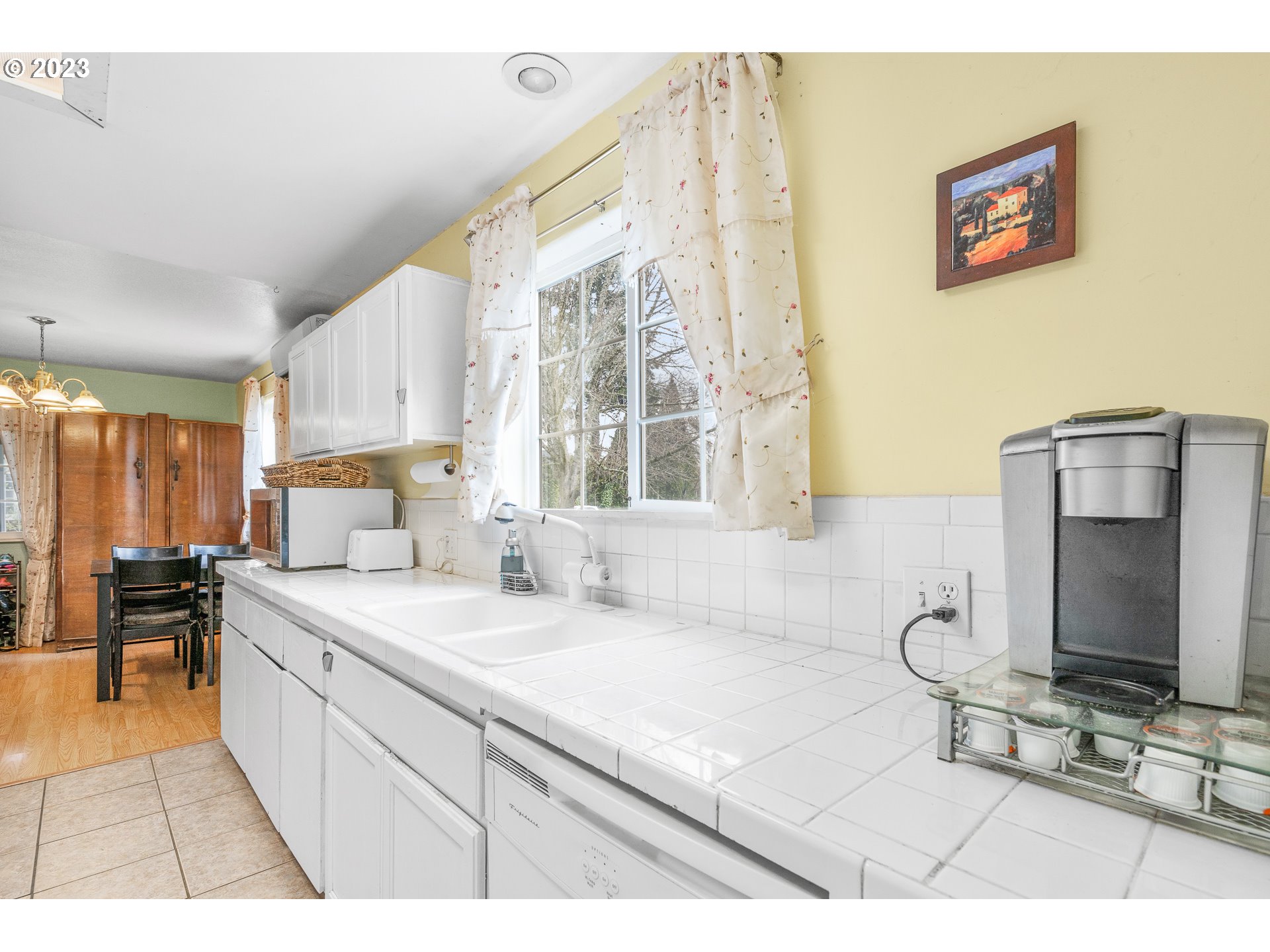 471 West M Street Springfield, OR 97477 - Photo 10 of 37 a kitchen with a sink cabinets and window