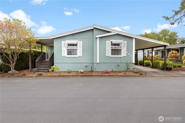a front view of house with garage and yard