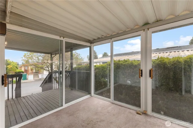 a view of room with window and a porch