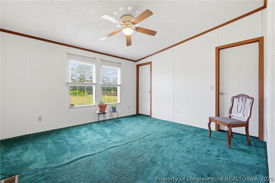 10400 Ruth Vinson Road Autryville, NC 28318 - Photo 35 of 49 a view of an empty room with window and hardwood floor