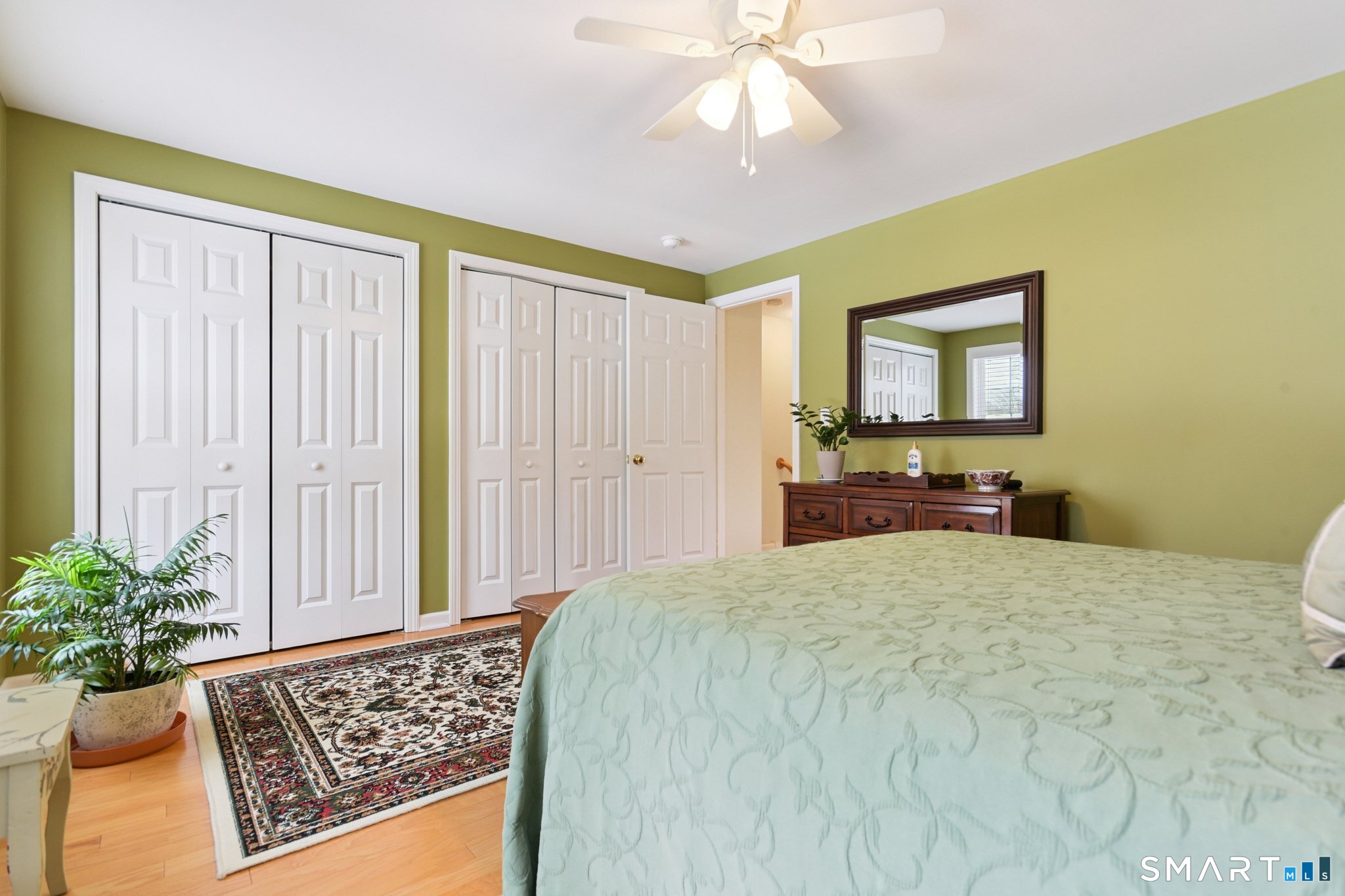 2 Bull Avenue, Unit A3 Wallingford, CT 06492 - Photo 14 of 23 a spacious bedroom with a bed and a chandelier