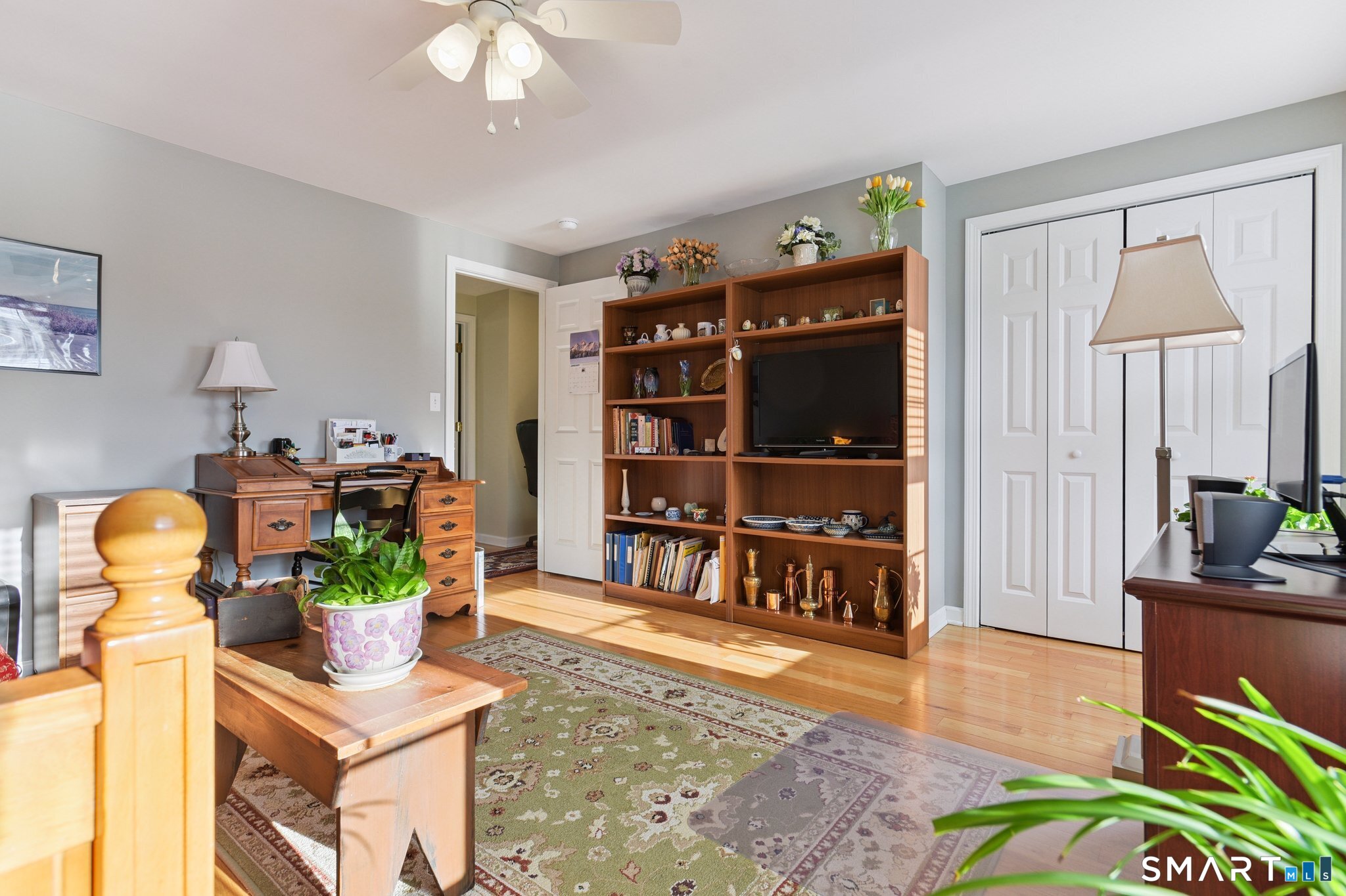 2 Bull Avenue, Unit A3 Wallingford, CT 06492 - Photo 17 of 23 a living room with fireplace furniture and a flat screen tv