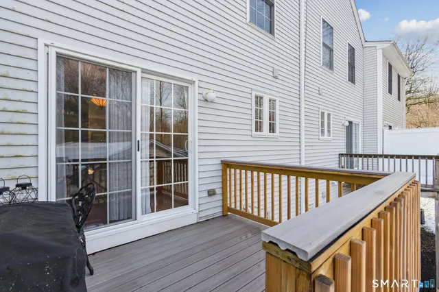 a view of staircase with a rug