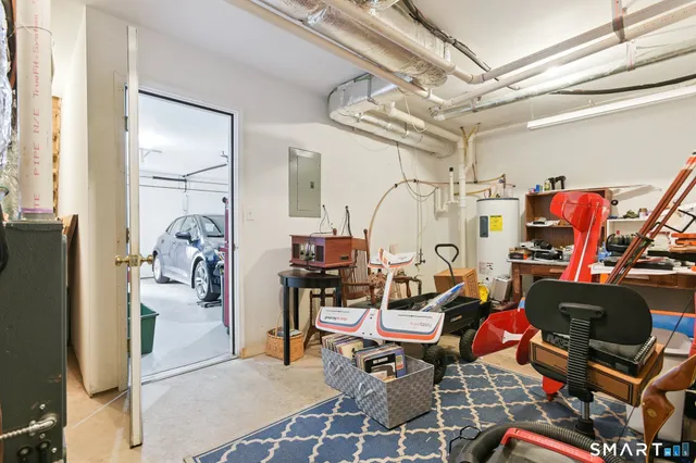 a living room with lots of furniture and gym equipment