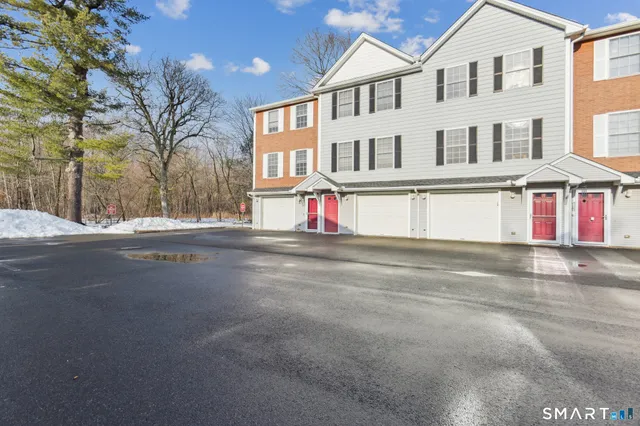a view of multiple houses with a street