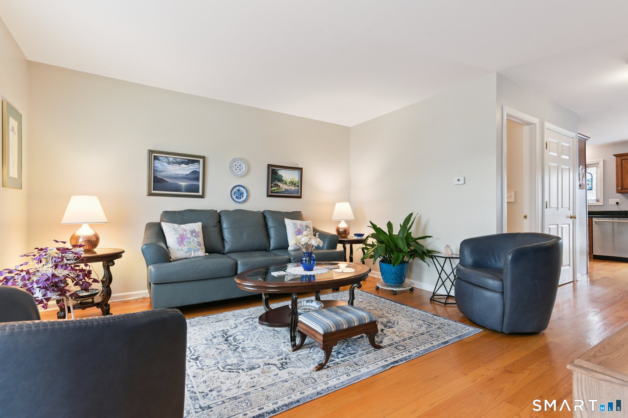 2 Bull Avenue, Unit A3 Wallingford, CT 06492 - Photo 3 of 23 a living room with furniture potted plant and a lamp