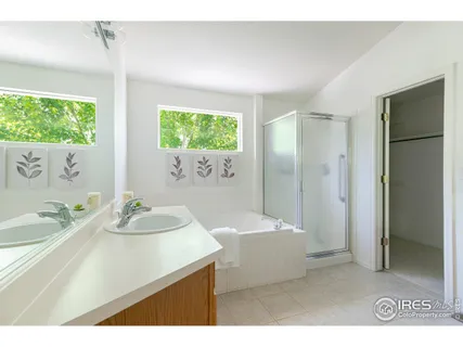 a bathroom with a sink a mirror and a bathtub