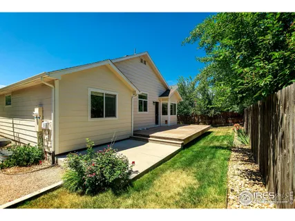 a backyard of a house with seating space