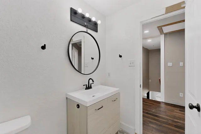 a bathroom with a sink and a mirror