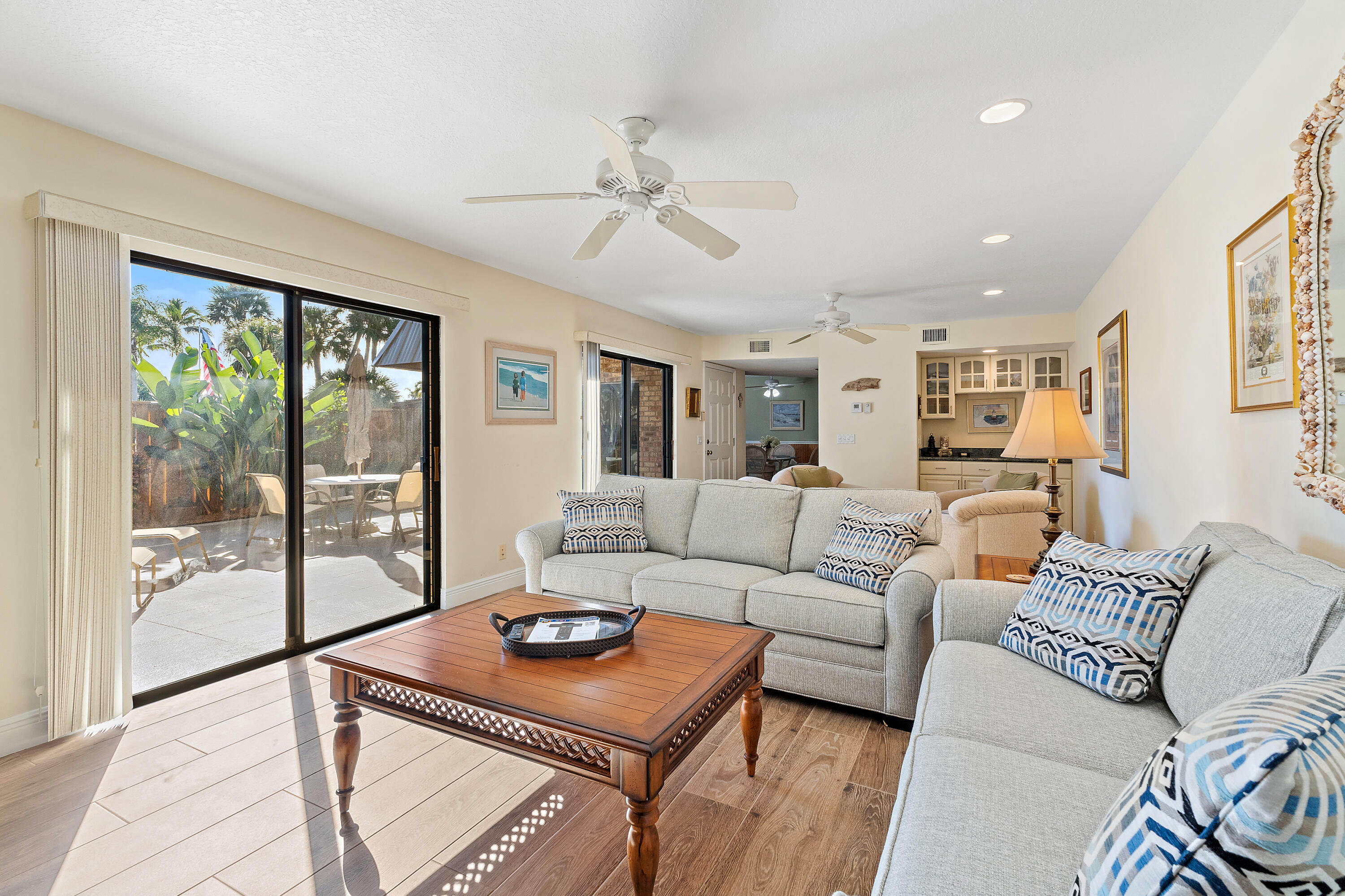 1420 Ocean Way, Unit 28D Jupiter, FL 33477 - Photo 13 of 33 a living room with furniture and a floor to ceiling window