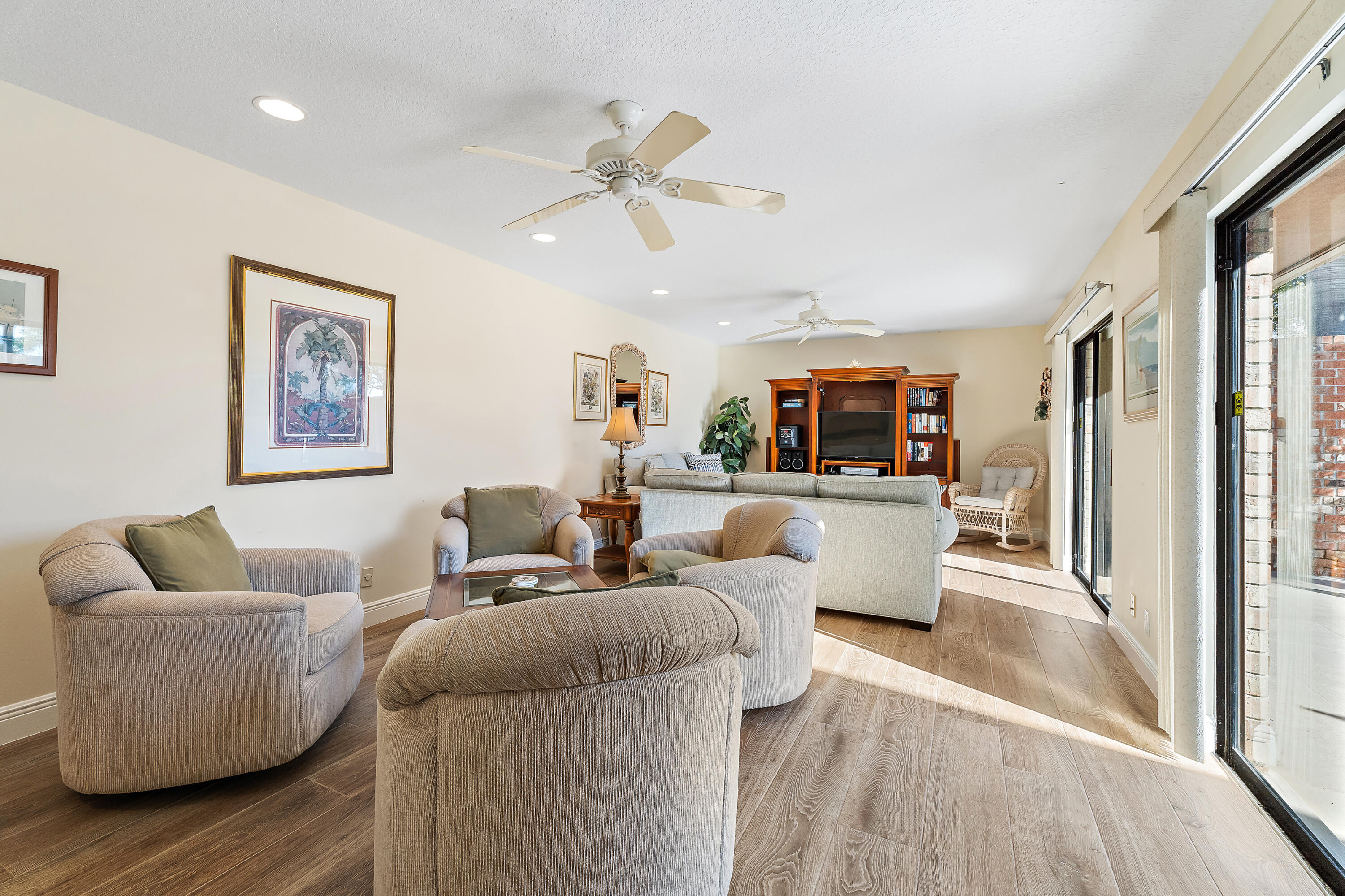 1420 Ocean Way, Unit 28D Jupiter, FL 33477 - Photo 14 of 33 a living room with furniture and a wooden floor