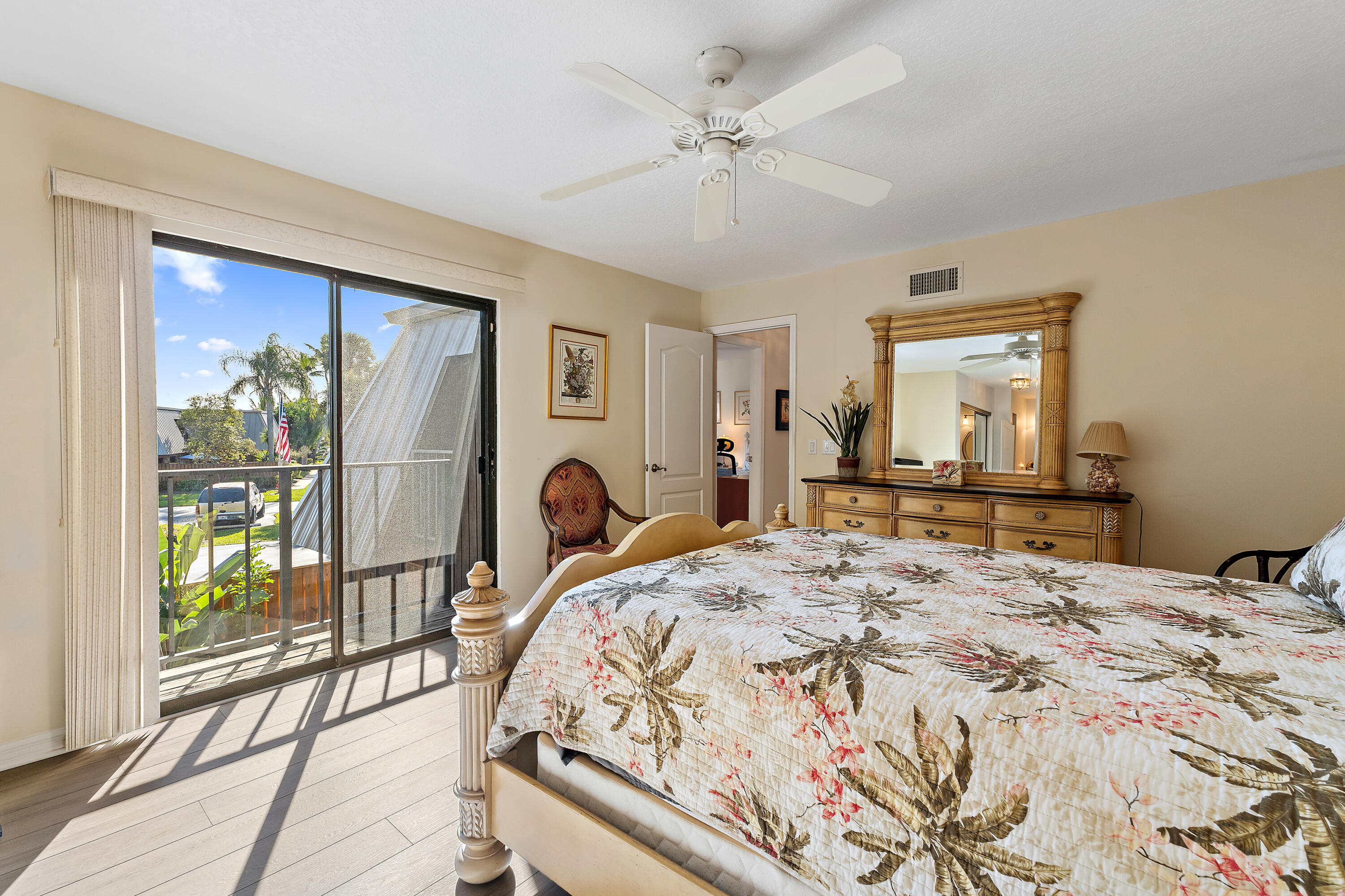 1420 Ocean Way, Unit 28D Jupiter, FL 33477 - Photo 20 of 33 a bedroom with a bed and a large window with outer view