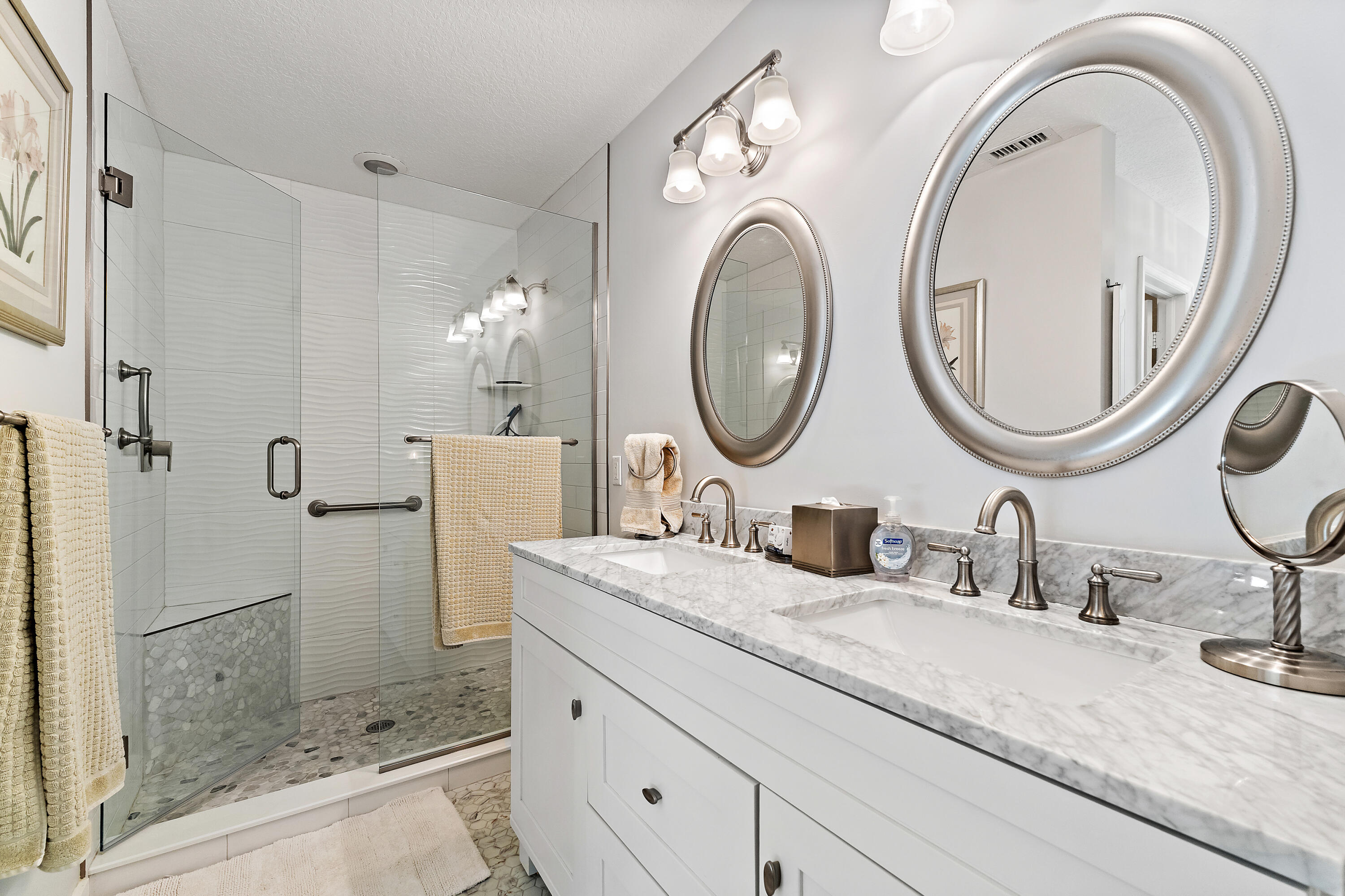 1420 Ocean Way, Unit 28D Jupiter, FL 33477 - Photo 22 of 33 a bathroom with a granite countertop sink a mirror and shower