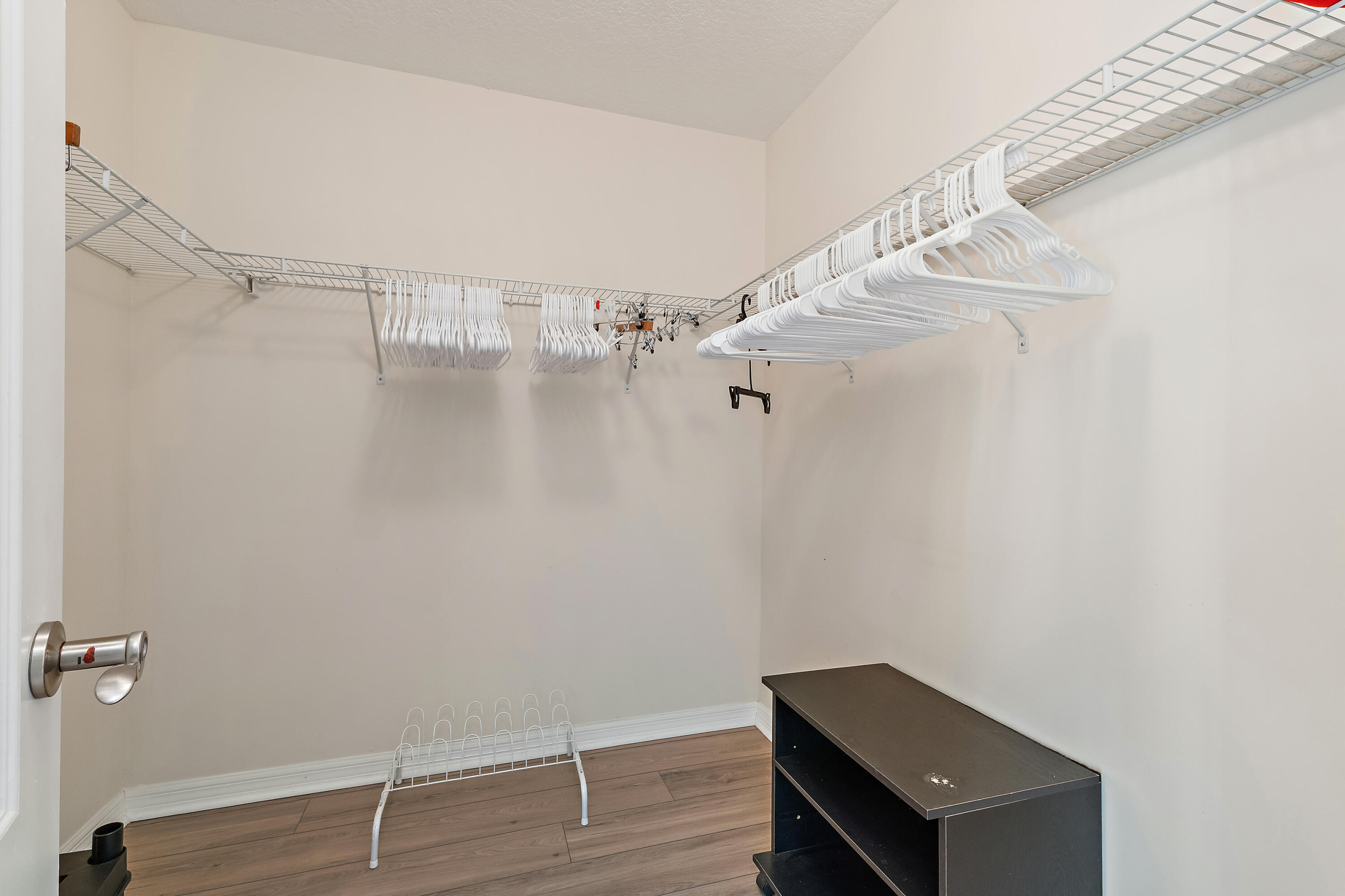 1420 Ocean Way, Unit 28D Jupiter, FL 33477 - Photo 23 of 33 a view of room with racks on the wall