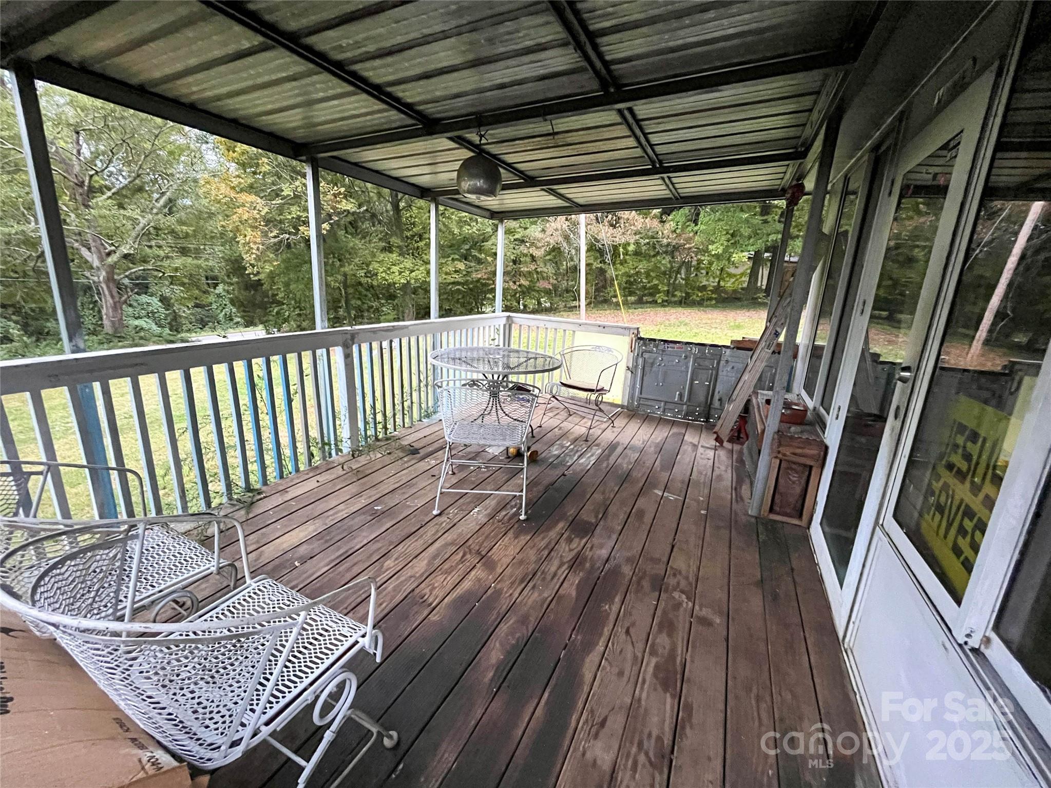 608 Crowders Creek Road Gastonia, NC 28052 - Photo 16 of 18 a view of balcony with wooden floor and outdoor seating