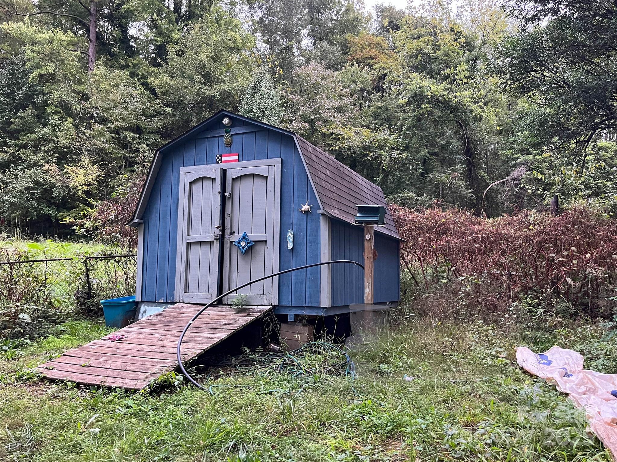 608 Crowders Creek Road Gastonia, NC 28052 - Photo 17 of 18 a view of a small house with a yard