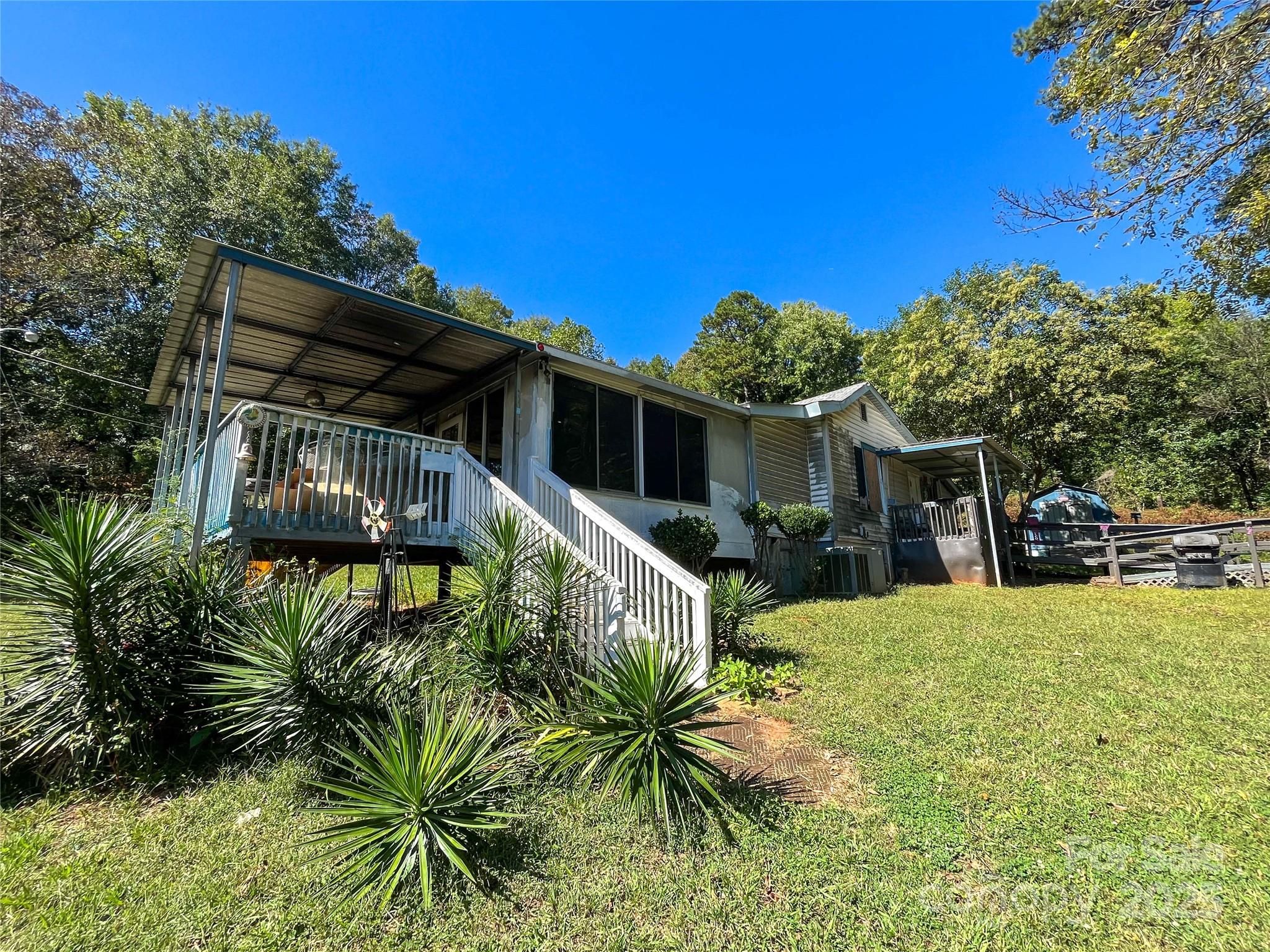 608 Crowders Creek Road Gastonia, NC 28052 - Photo 2 of 18 a view of a house with a yard