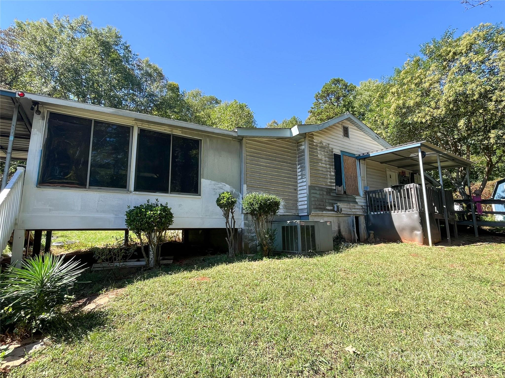 608 Crowders Creek Road Gastonia, NC 28052 - Photo 5 of 18 a front view of a house with a yard outdoor seating and entertaining space
