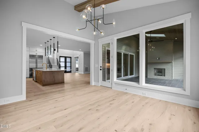 a spacious bathroom with a double vanity sink a mirror and a bathtub