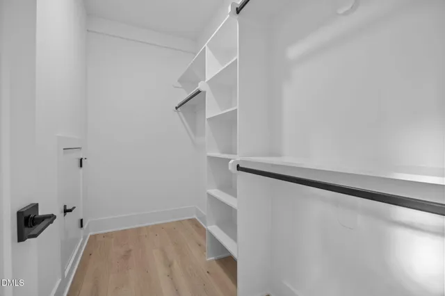 a bathroom with a sink a toilet and a large mirror