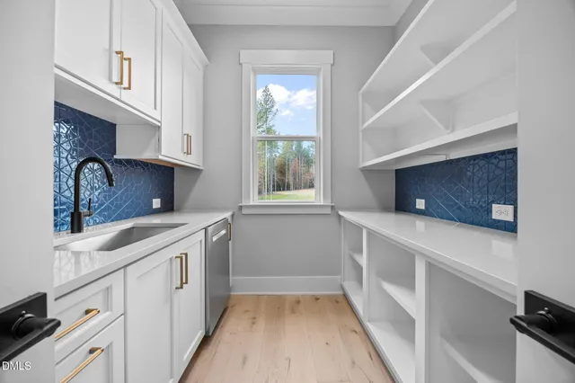 a view of kitchen with stainless steel appliances granite countertop cabinets and wooden floor