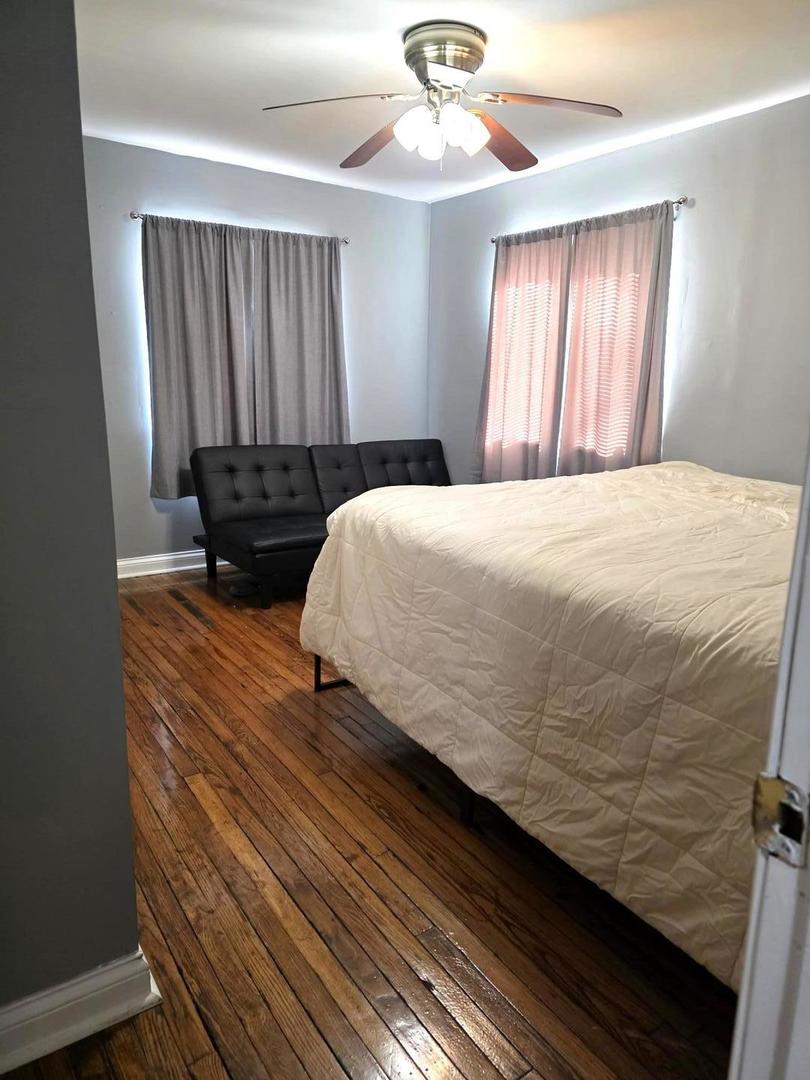 2709 North River Isle Road Momence, IL 60954 - Photo 9 of 23 a bedroom with a bed and wooden floor