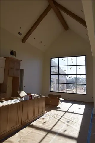 a room with a bed and window