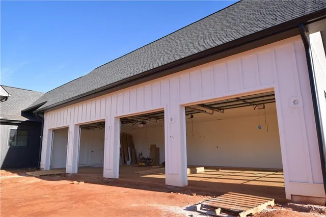 a view of a small space with wooden floor and a window