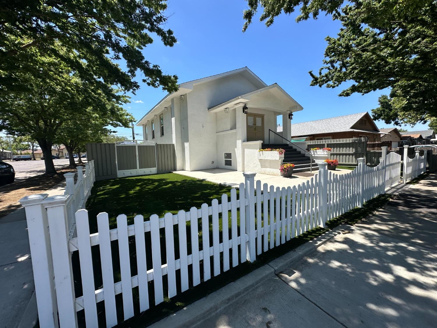 701 2nd Street Modesto, CA 95351 - Photo 1 of 1 a front view of a house with a garden