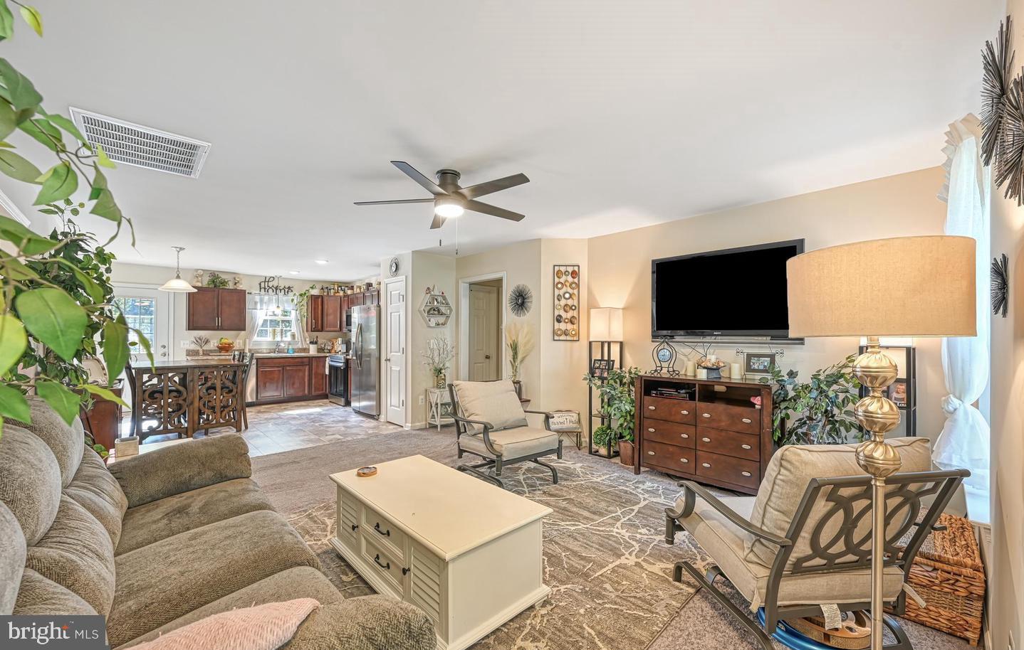 6121 Belmont Road Mineral, VA 23117 - Photo 11 of 32 a living room with furniture and a flat screen tv