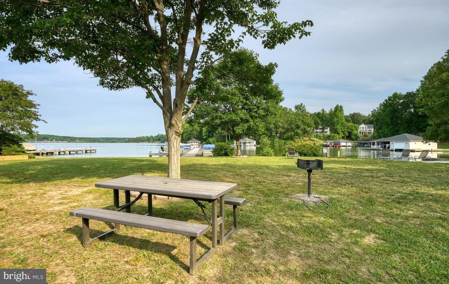 6121 Belmont Road Mineral, VA 23117 - Photo 26 of 32 a park view with a bench and trees around