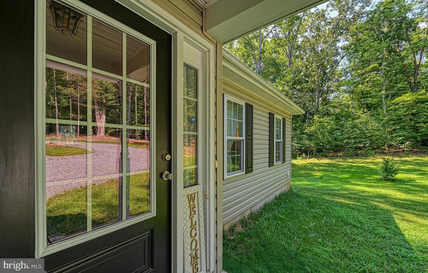 6121 Belmont Road Mineral, VA 23117 - Photo 3 of 32 a view of a porch with a big yard