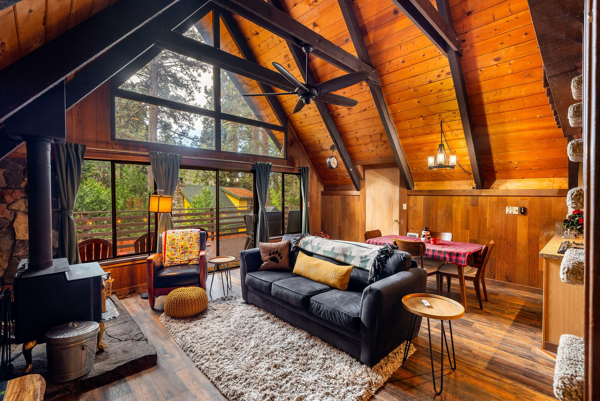 52515 Sunset Drive Idyllwild, CA 92549 - Photo 16 of 42 a living room with furniture and a floor to ceiling window