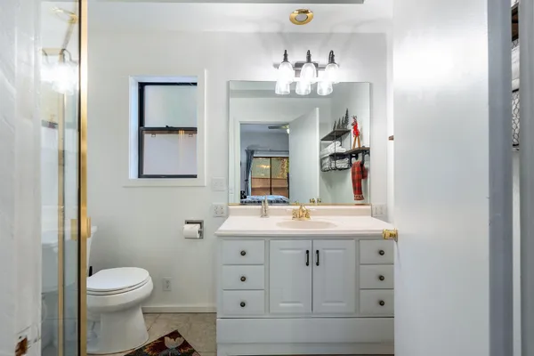 a bedroom with a bed and walk in closet