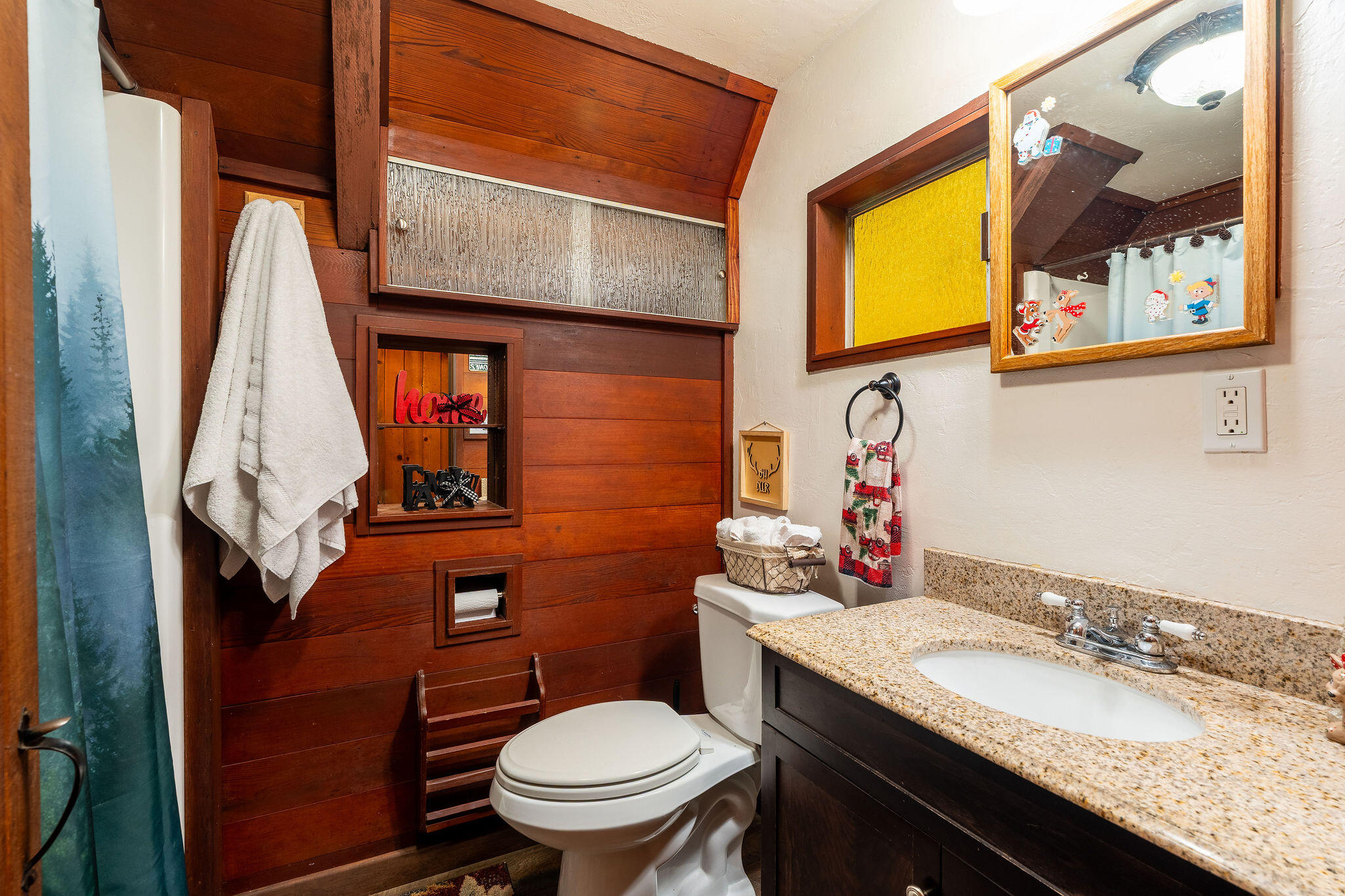 52515 Sunset Drive Idyllwild, CA 92549 - Photo 5 of 42 a bathroom with a granite countertop toilet sink and mirror