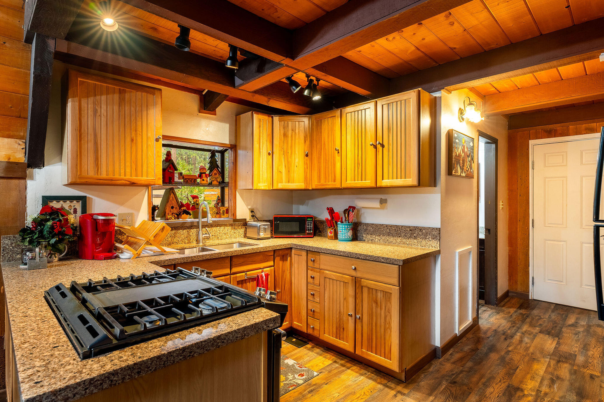 52515 Sunset Drive Idyllwild, CA 92549 - Photo 10 of 42 a kitchen with stainless steel appliances granite countertop a stove a sink and a refrigerator