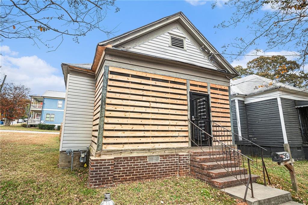 56 Ormond Street Southeast Atlanta, GA 30315 - Photo 2 of 15 a view of a house with a balcony