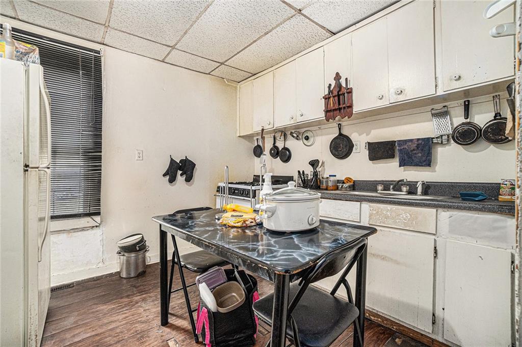56 Ormond Street Southeast Atlanta, GA 30315 - Photo 5 of 15 a kitchen with a table and chairs in it