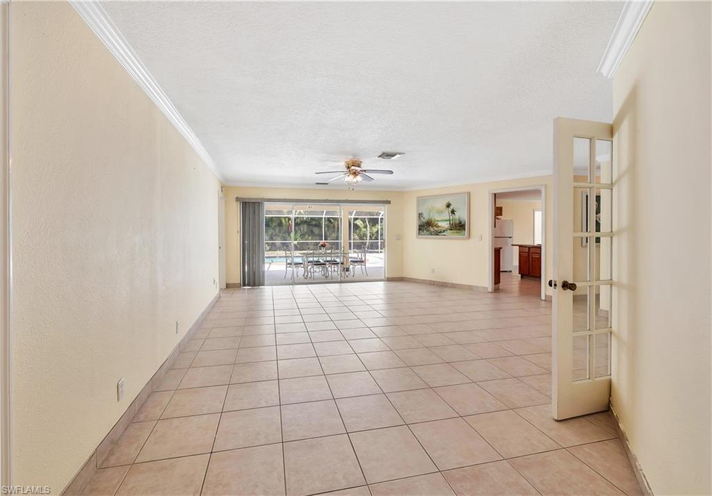 639 Pompano Drive Naples, FL 34110 - Photo 15 of 39 a view of empty room with wooden floor