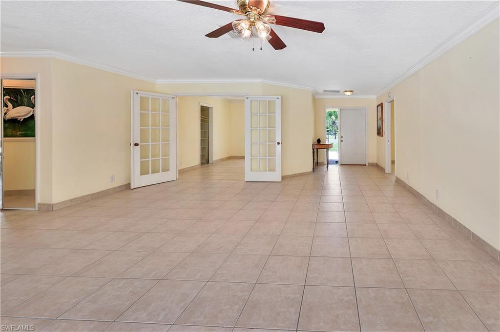 639 Pompano Drive Naples, FL 34110 - Photo 16 of 39 a view of an empty room with a window
