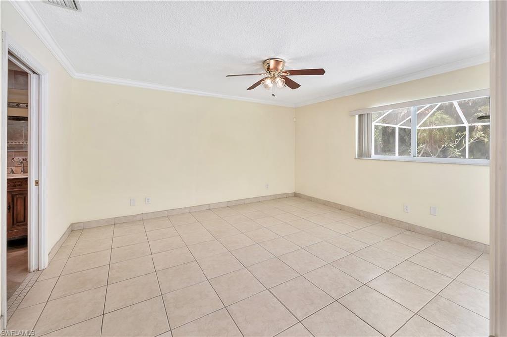 639 Pompano Drive Naples, FL 34110 - Photo 26 of 39 a view of an empty room with a window
