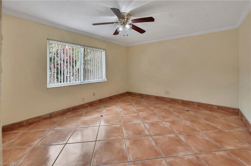 639 Pompano Drive Naples, FL 34110 - Photo 31 of 39 a view of an empty room with a window