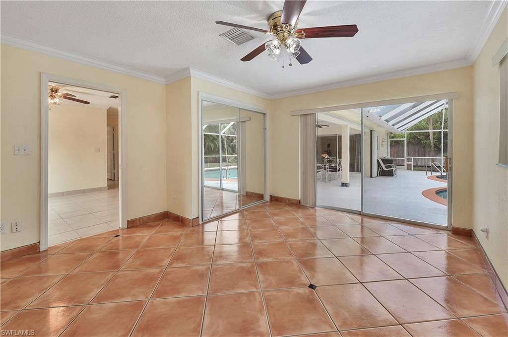 639 Pompano Drive Naples, FL 34110 - Photo 36 of 39 a view of an entryway with a chandelier fan